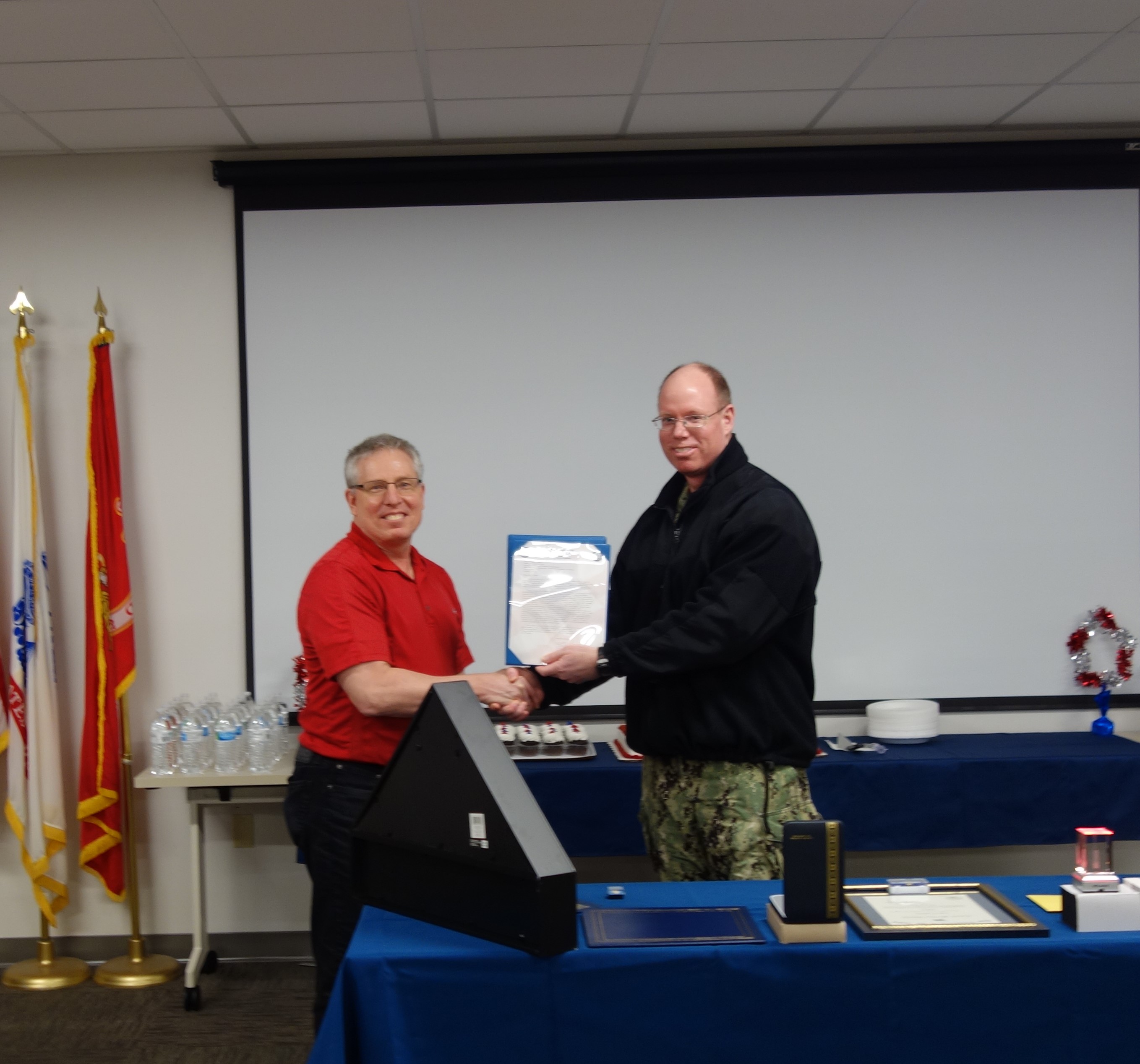 Figure 2: Doug Crowe receiving his MCSA from CAPT McKay in ceremony Figure 2: Doug Crowe receiving his MCSA from CAPT McKay in ceremony